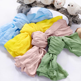 DeZerlor 20-pack gauze napkins in four colors for versatile celebrations.