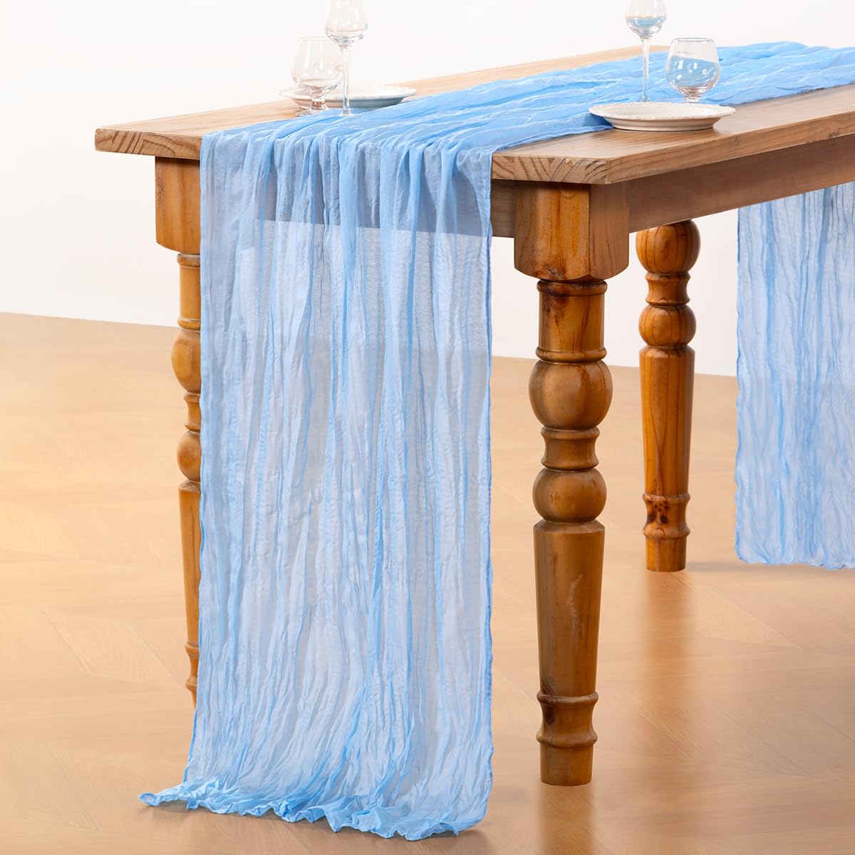 DeZerlor Baby Blue Cheesecloth Table Runner outdoor-dining setup suits patios and picnics.