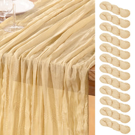 DeZerlor champagne gold cheesecloth table runner setup for elegant wedding tables.