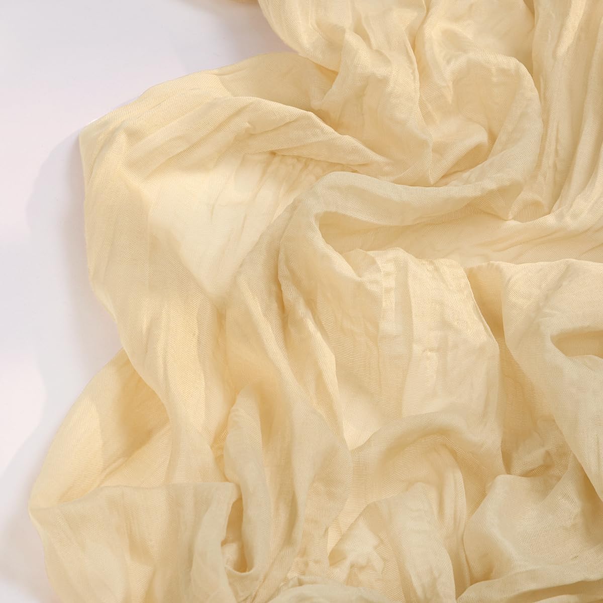 Wrinkle texture of DeZerlor champagne gold cheesecloth adds rustic charm.