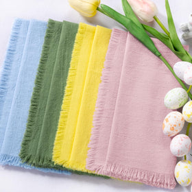DeZerlor baby blue fringe napkins brighten everyday meals.