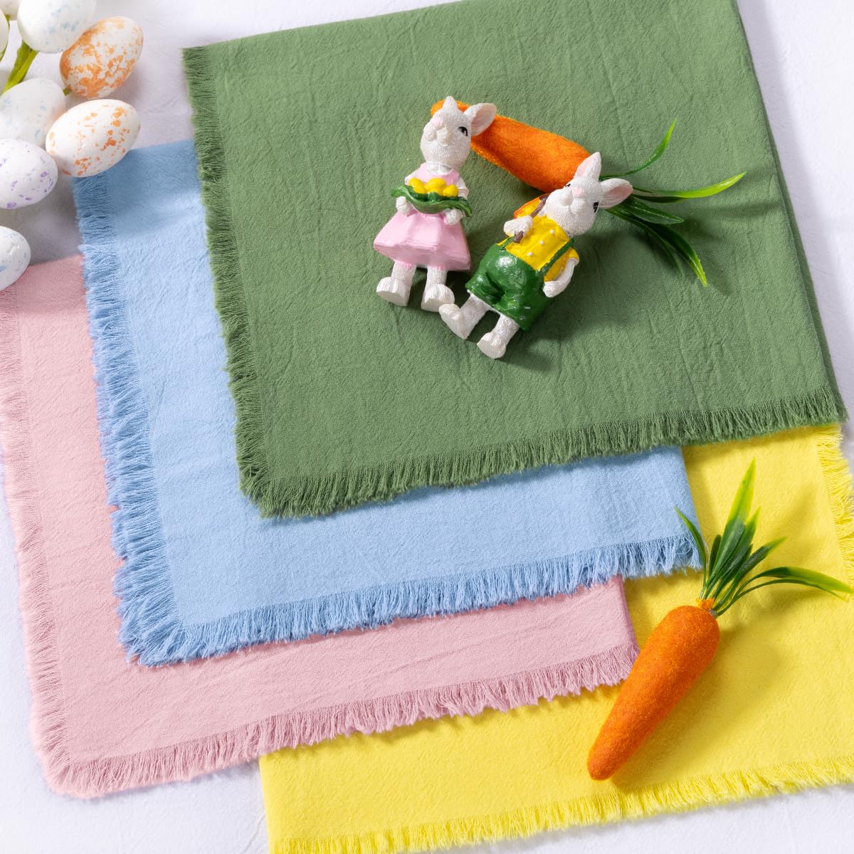 DeZerlor sage green fringe napkins pair with greenery.