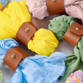 DeZerlor napkins fold into roses and pockets for elegant decor.