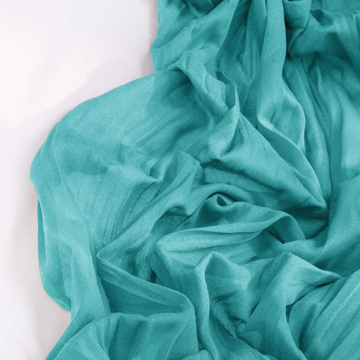 DeZerlor teal green cheesecloth runner close-up shows soft texture and finished edges