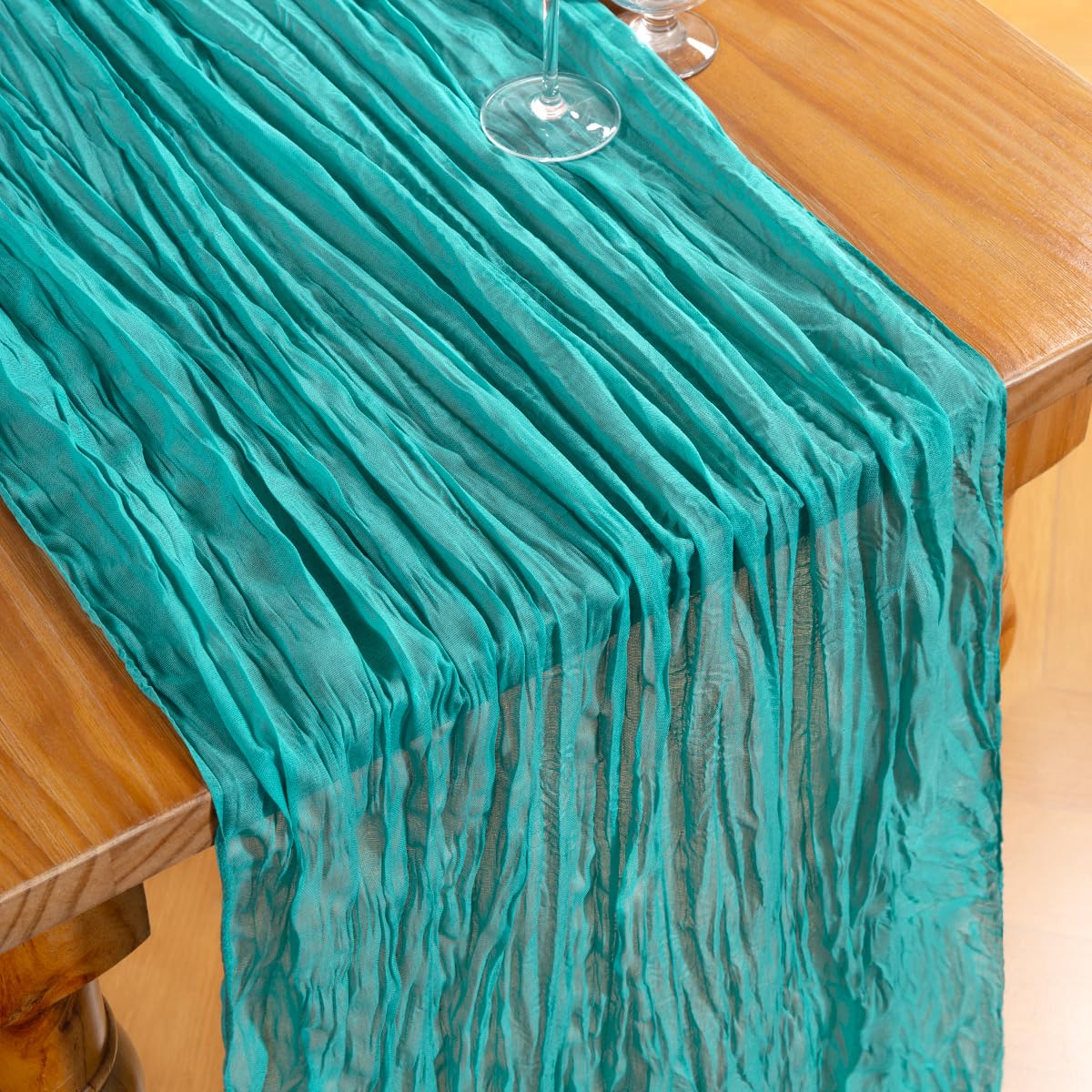 DeZerlor Teal Green Cheesecloth Runner draped elegantly on a dining table