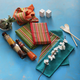 DG Collections Salsa Stripe towel used with glassware to prevent lint.
