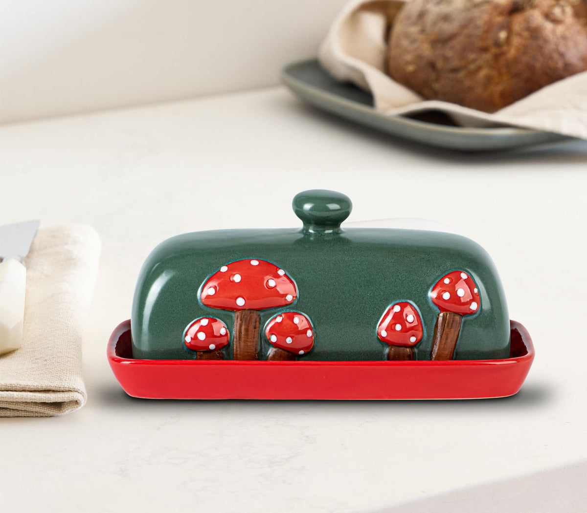 dgudgu mushroom butter dish with lid on counter in bright kitchen