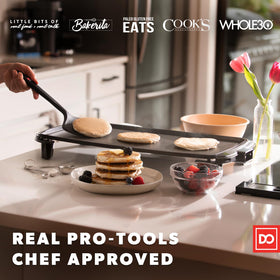 DI ORO Living silicone turners with ergonomic grip for precise flipping.