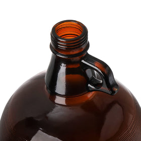 Dicunoy amber glass jug highlights light protection for beverages.