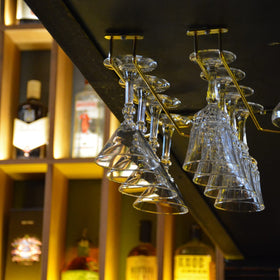 Dicunoy wall-mount display rack keeps countertops clear and organized.