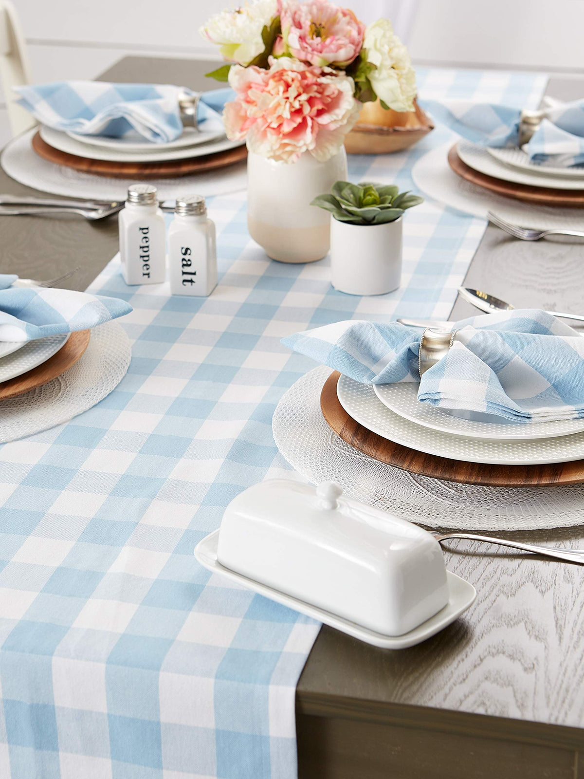 DII buffalo check runner pairs with blue and white dinnerware.