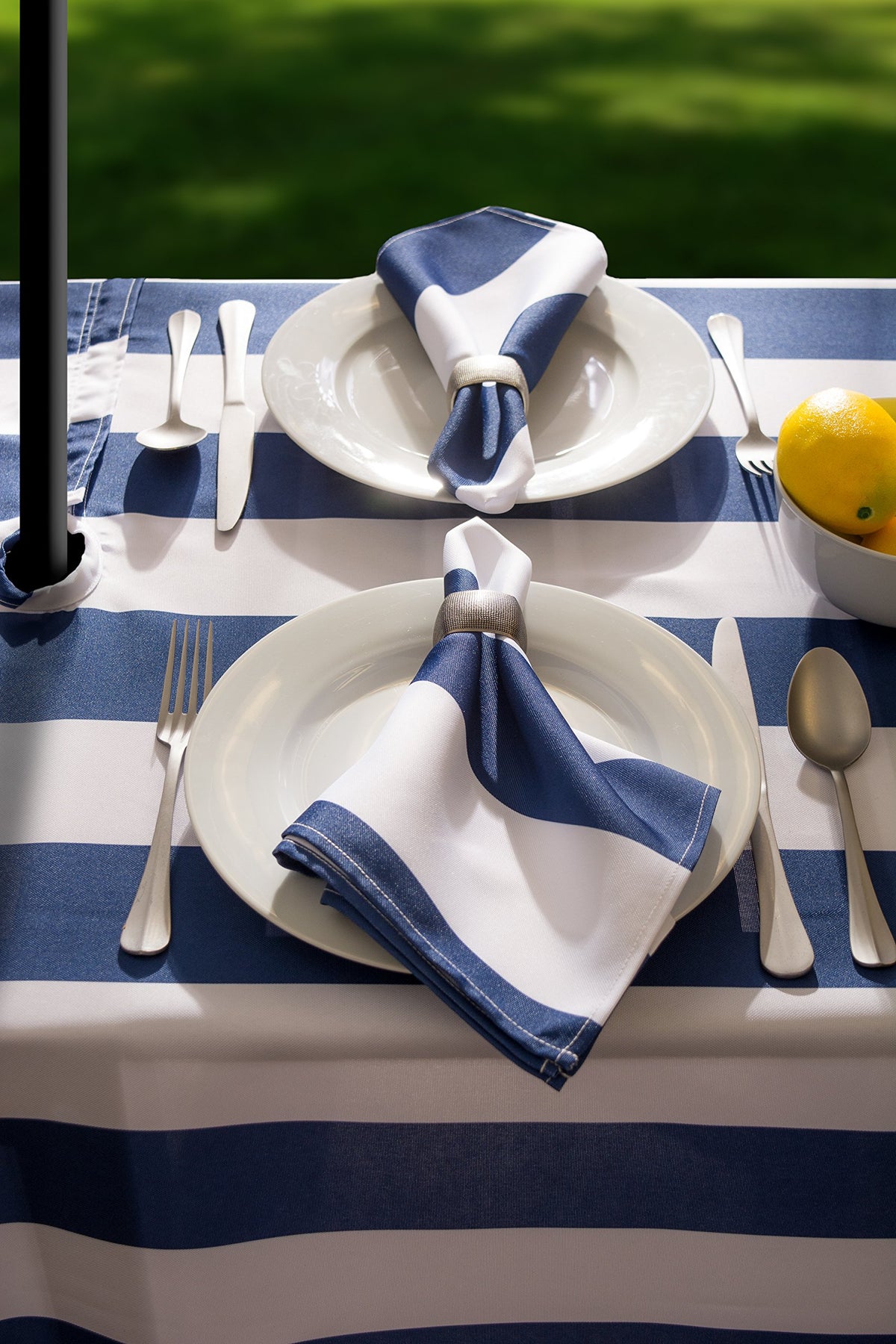 DII Cabana Stripe 60x84 round tablecloth on dining table.