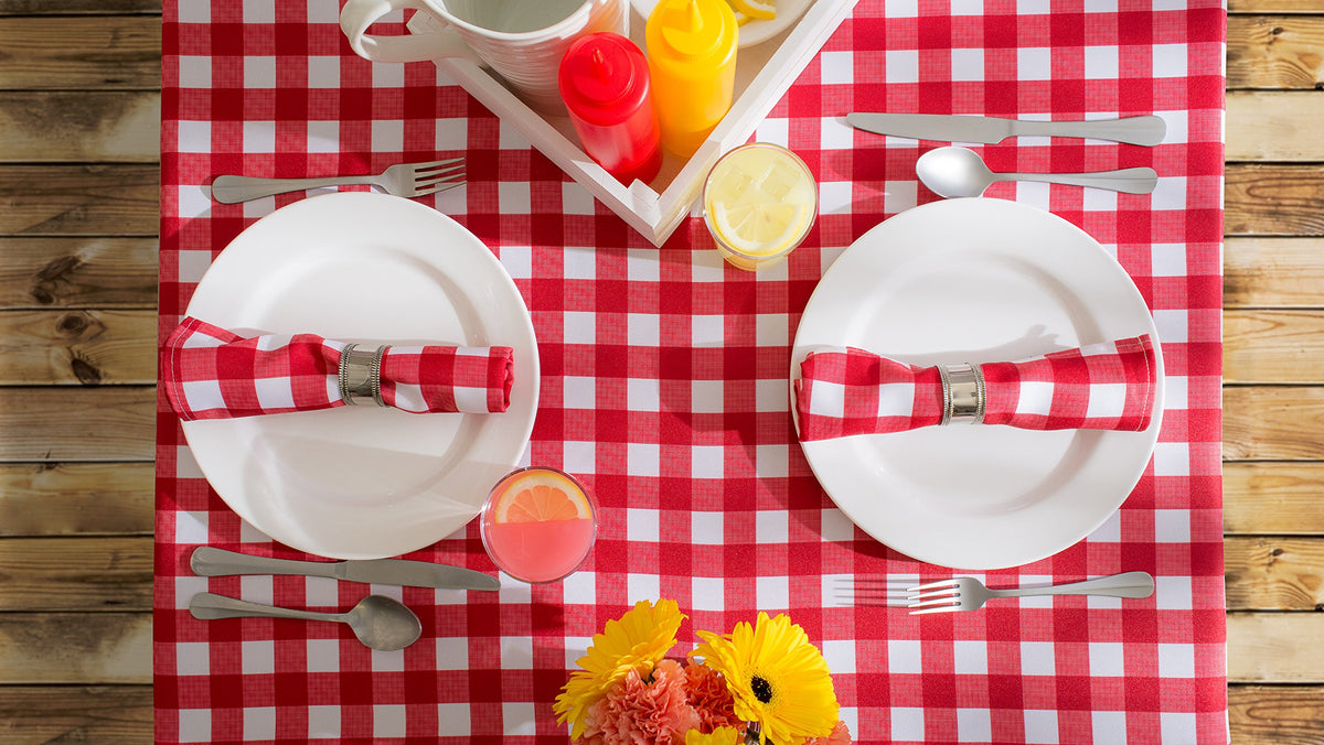 DII table area with checkered cloth and a centerpiece for a warm dining space.
