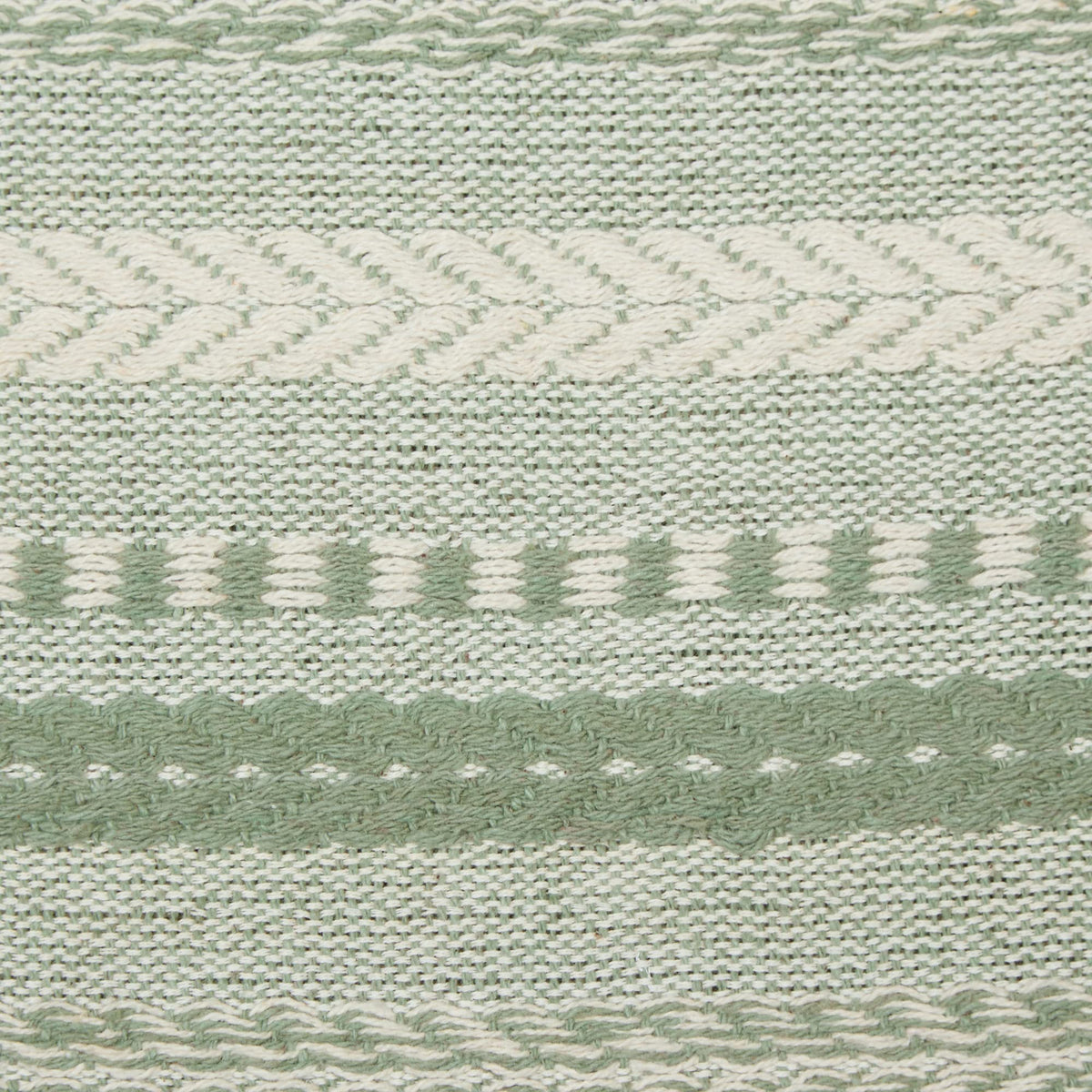 DII Farmhouse Braided Stripe Table Runner artichoke green on dining table for rustic elegance