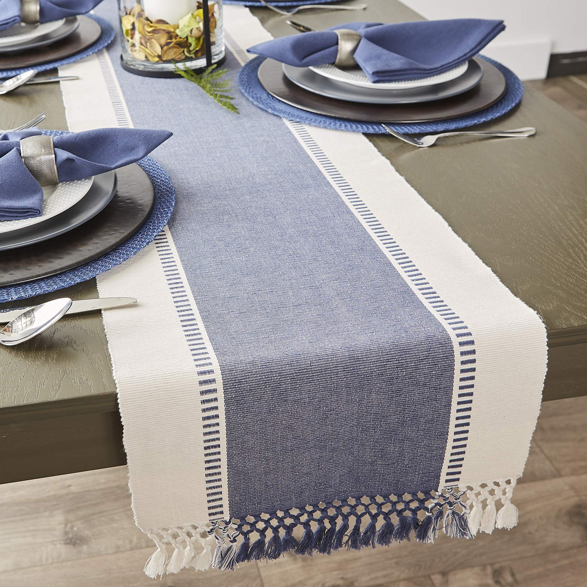 DII table runner styled on a dining table with dinnerware.