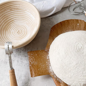 Dimpola banneton basket flour dusting shows proper nonstick surface preparation