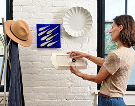 Display Buddie stainless wire arms provide discreet surface protection for displays.