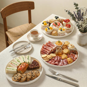 Dizada porcelain platter with stripe detail for refined tablescapes.