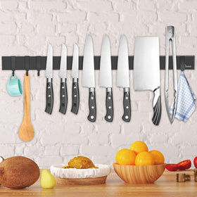 Dmore magnetic knife holder on wall with four hooks keeps knives organized.