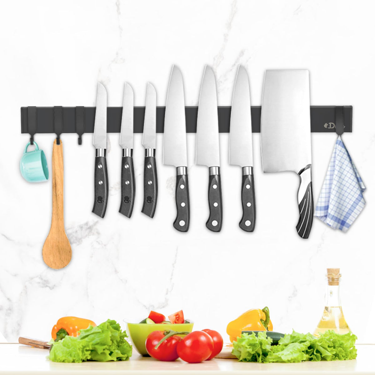 Dmore magnetic knife holder on wall with 4 hooks keeps knives within reach while cooking.
