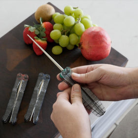Includes mini steel and gut hook sharpener for versatility