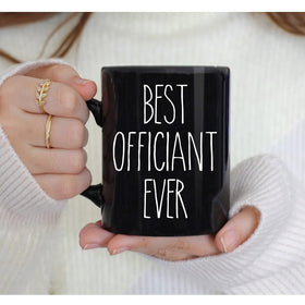 Dnuiyses officiant mug on desk, daily appreciation reminder.
