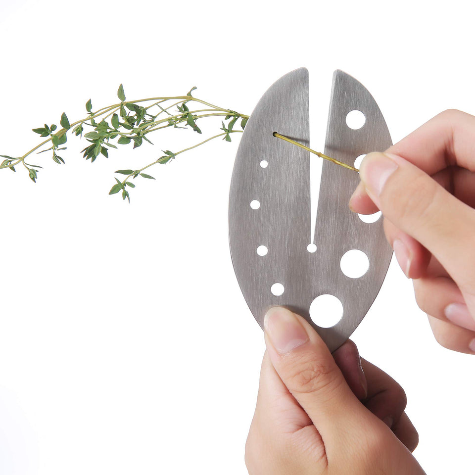 DOMG herb stripper with stainless steel handle removes kale leaves quickly and safely.