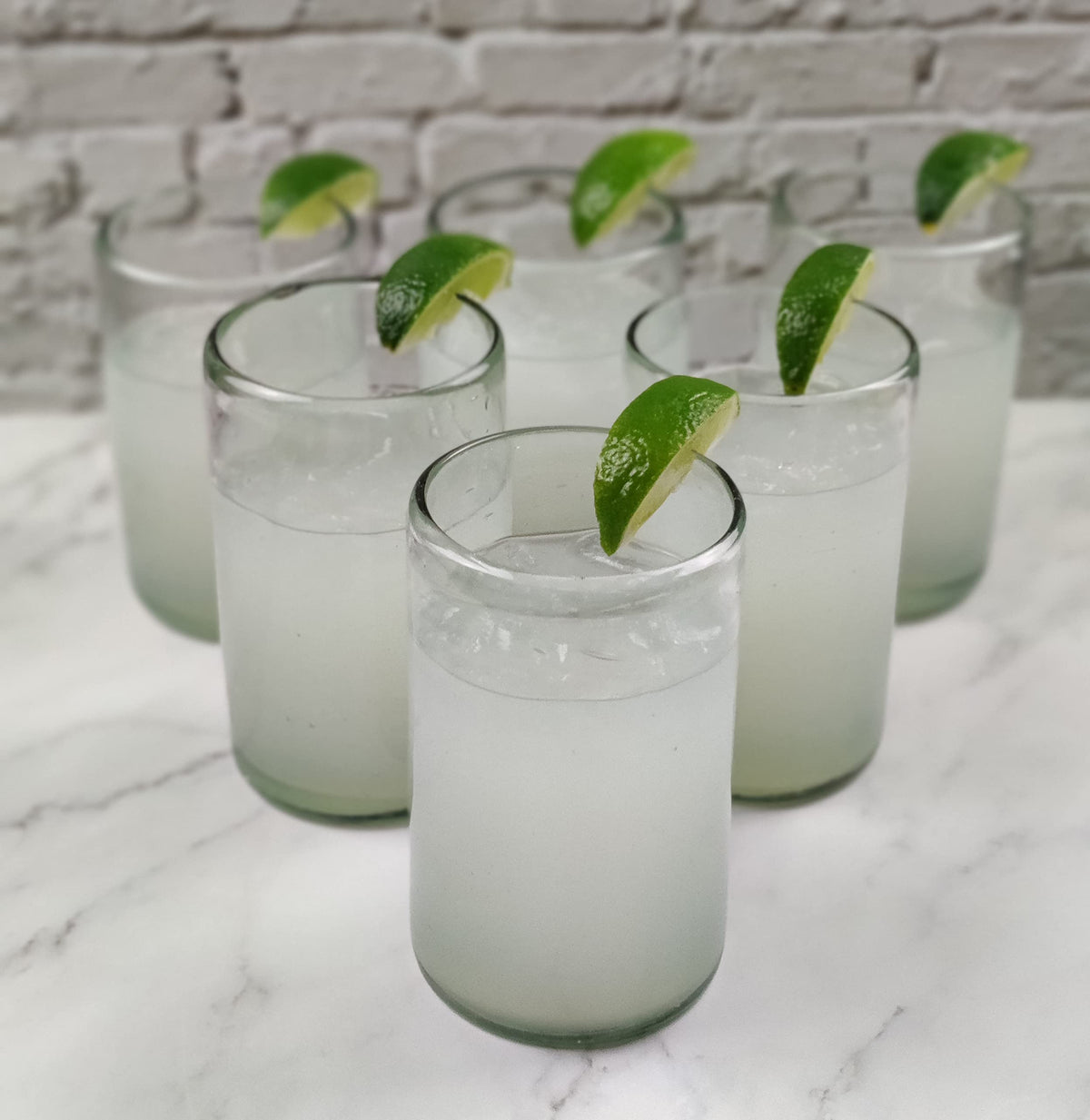 Dos Sueños artisan glassware six-set highlighting handmade character and variation.
