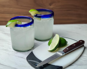 Dos Sueños cobalt blue rim glass ideal for iced beverages and gatherings.