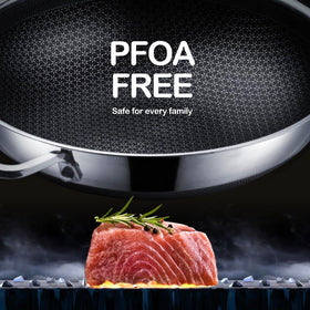 DOTCLAD 13-inch hybrid wok with nonstick surface minimizes sticking and cleanup.