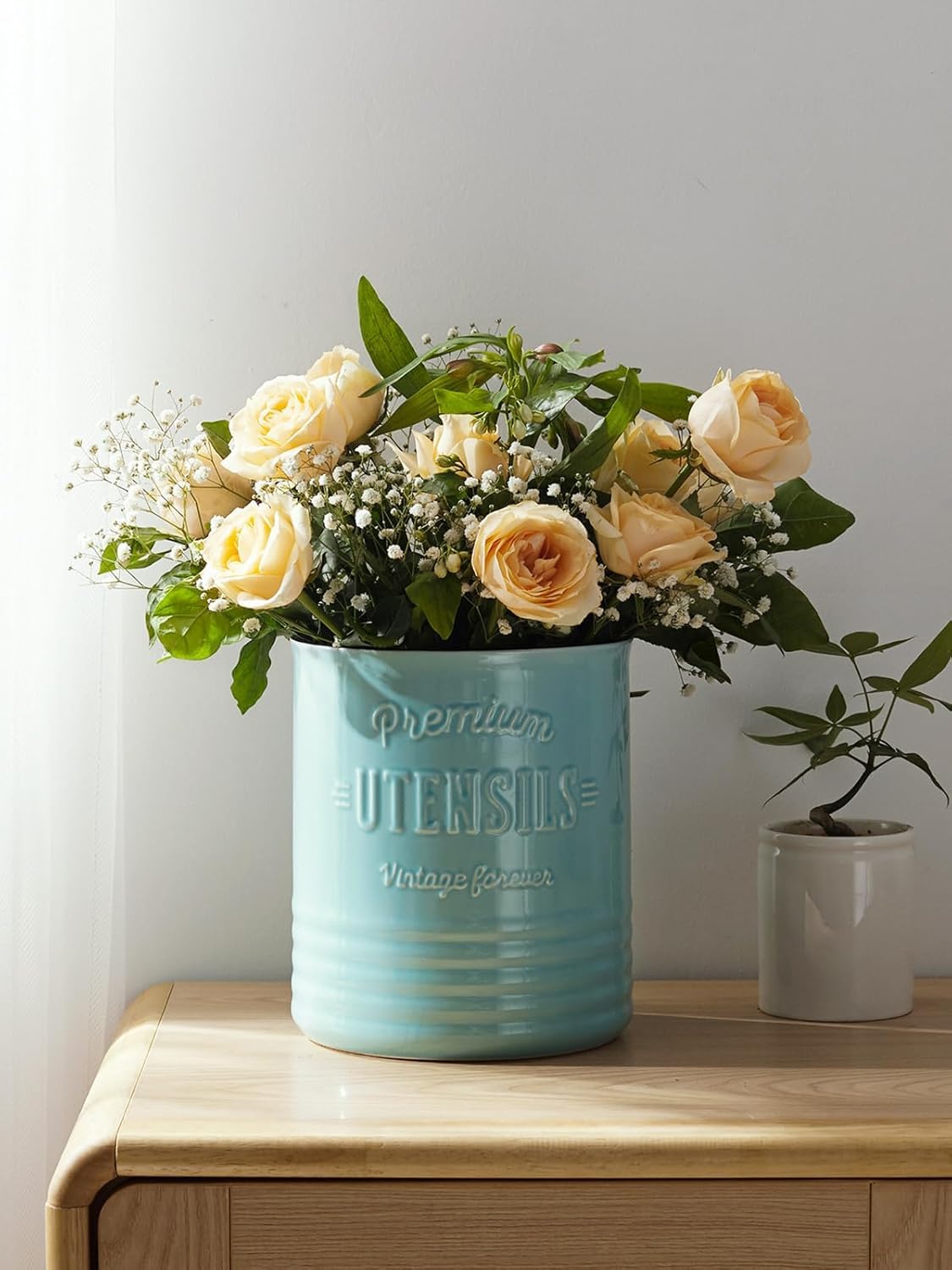 DOWAN farmhouse style turquoise crock complements rustic kitchen decor.