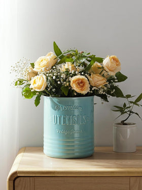 DOWAN farmhouse style turquoise crock complements rustic kitchen decor.