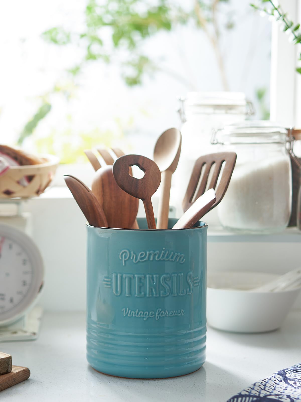 DOWAN cork mat under turquoise crock protects countertops from scratches.