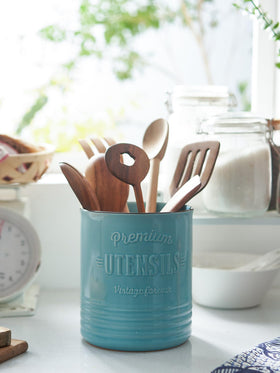 DOWAN cork mat under turquoise crock protects countertops from scratches.