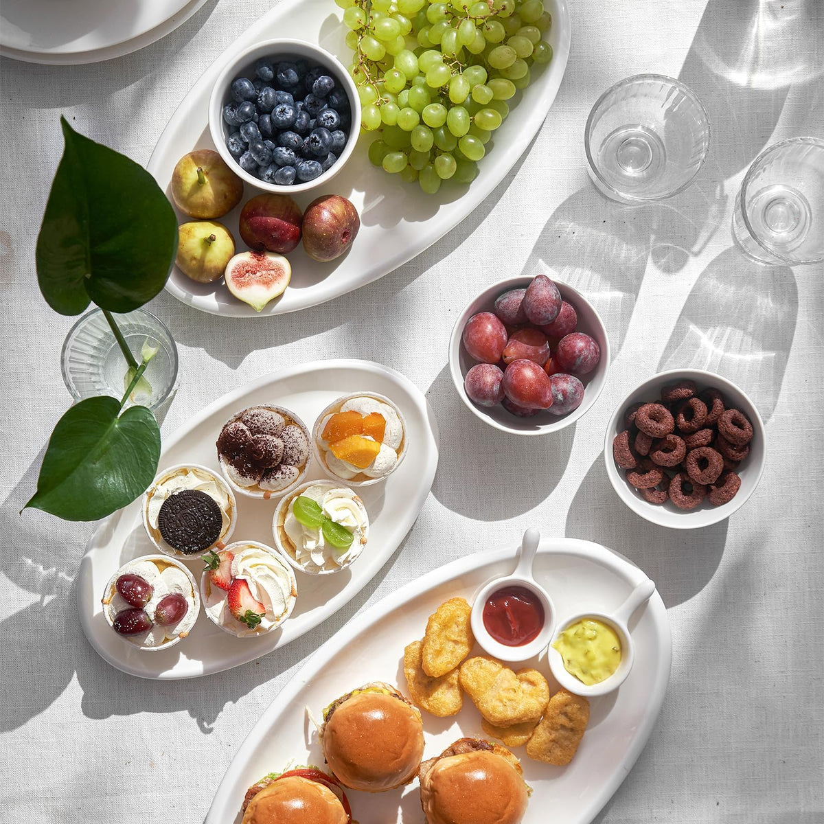 Dowan white porcelain platters add timeless elegance to tables