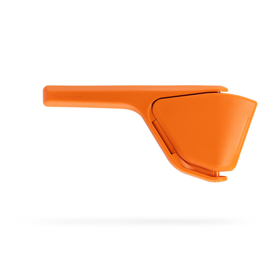 Dreamfarm Fluicer fold-flat juicer demonstrating space-saving design for drawers.