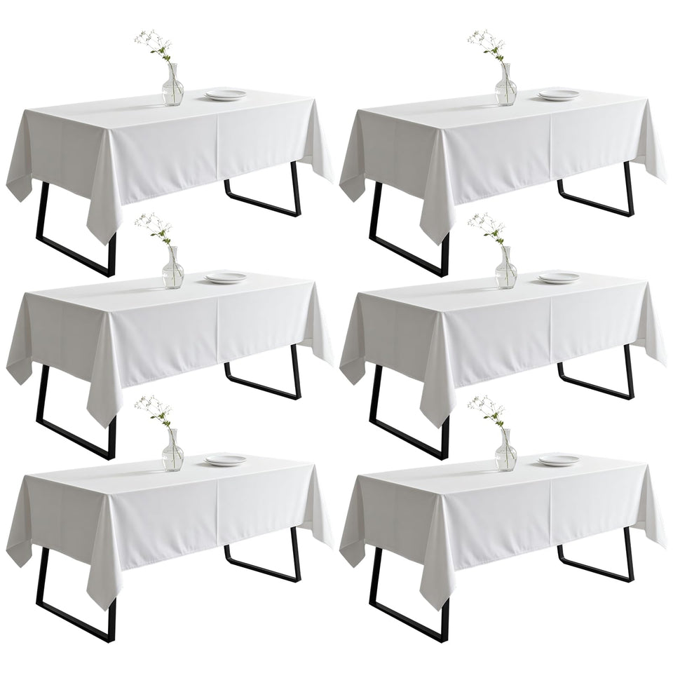 DRESSMAKER white 60x102 rectangle tablecloth for a clean, elegant setting.