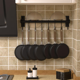 Dseap wall-mounted pot and pan rack in black provides easy access to cookware.