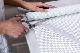 Duck EasyLiner Select Grip cut-to-fit demonstrates precise sizing for customized shelves