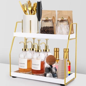 DWTS 2-tier coffee bar organizer on a gold frame keeps syrups and accessories neatly within reach.