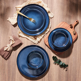 E-far table setting with Deep Sea Blue stoneware for elegant dining.