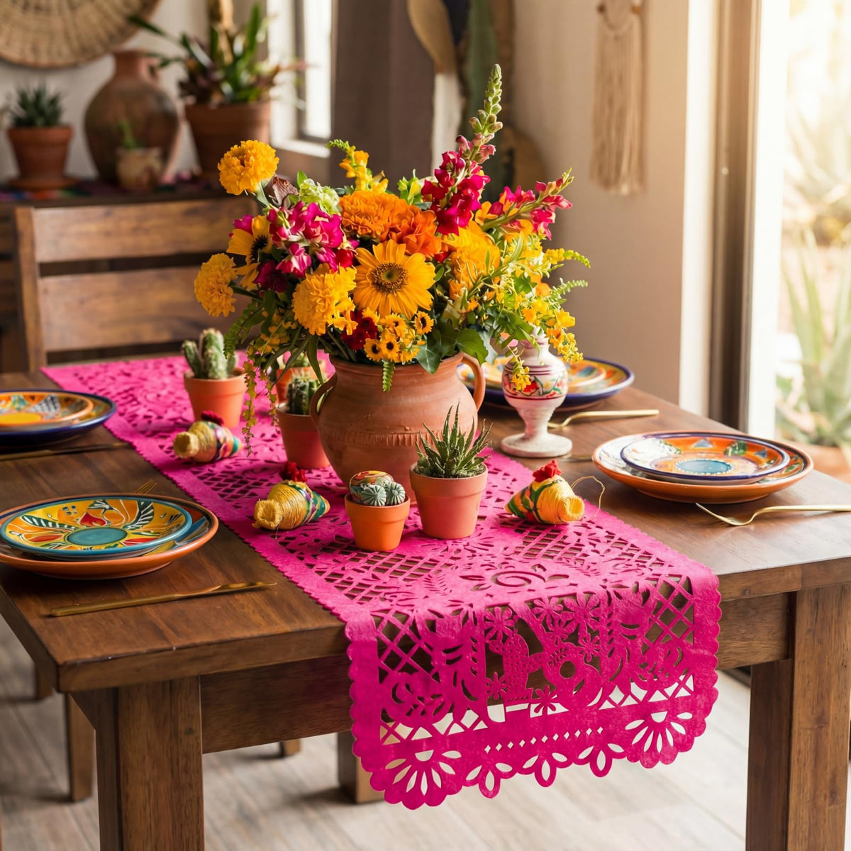 Eaasty green papel picado table runner enhances vibrant decor.