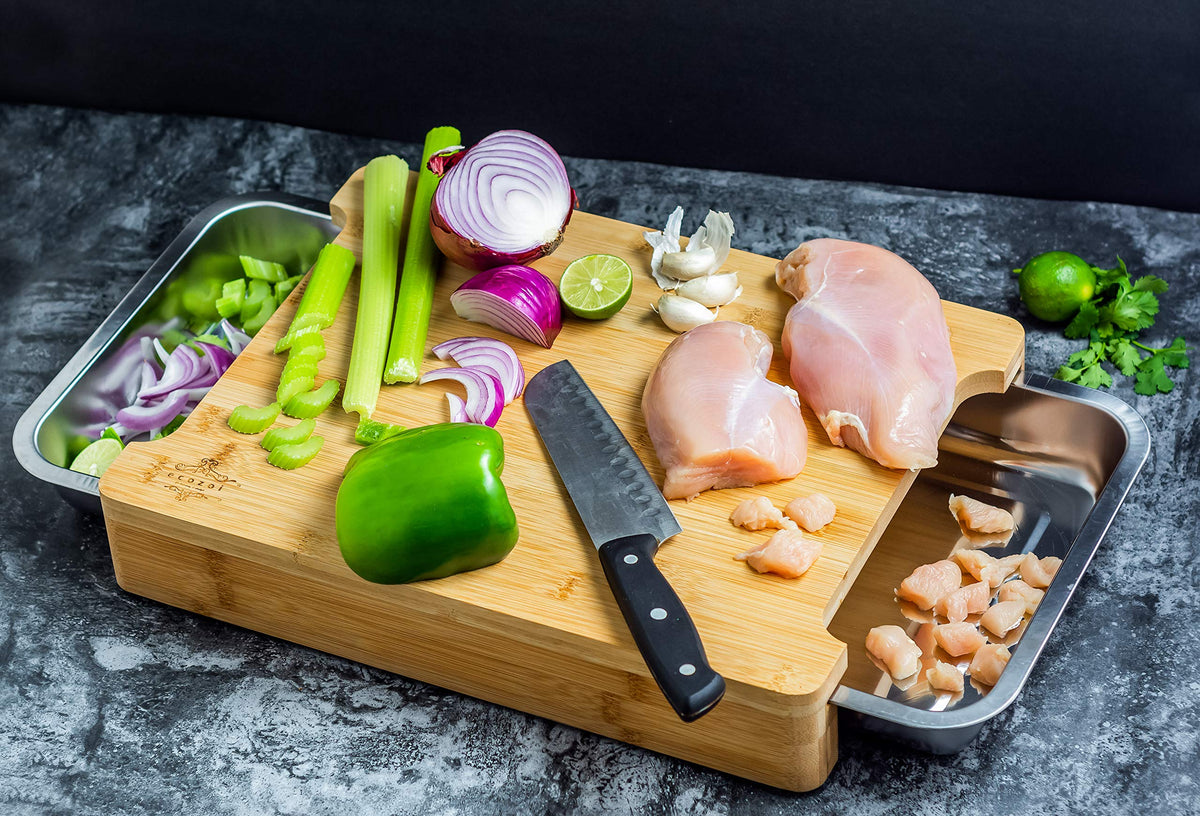 ecozoi cutting board with pull-out trays catches scraps for easy cleanup.