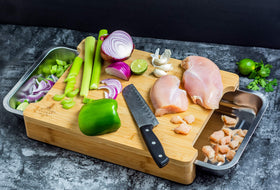 ecozoi cutting board with pull-out trays catches scraps for easy cleanup.