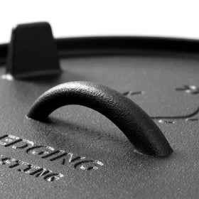 Thick iron design preserves heat for braising and simmering outdoors.