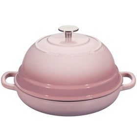 EDGING CASTING enameled Dutch oven pink exterior shows durable, even heating for bread baking.