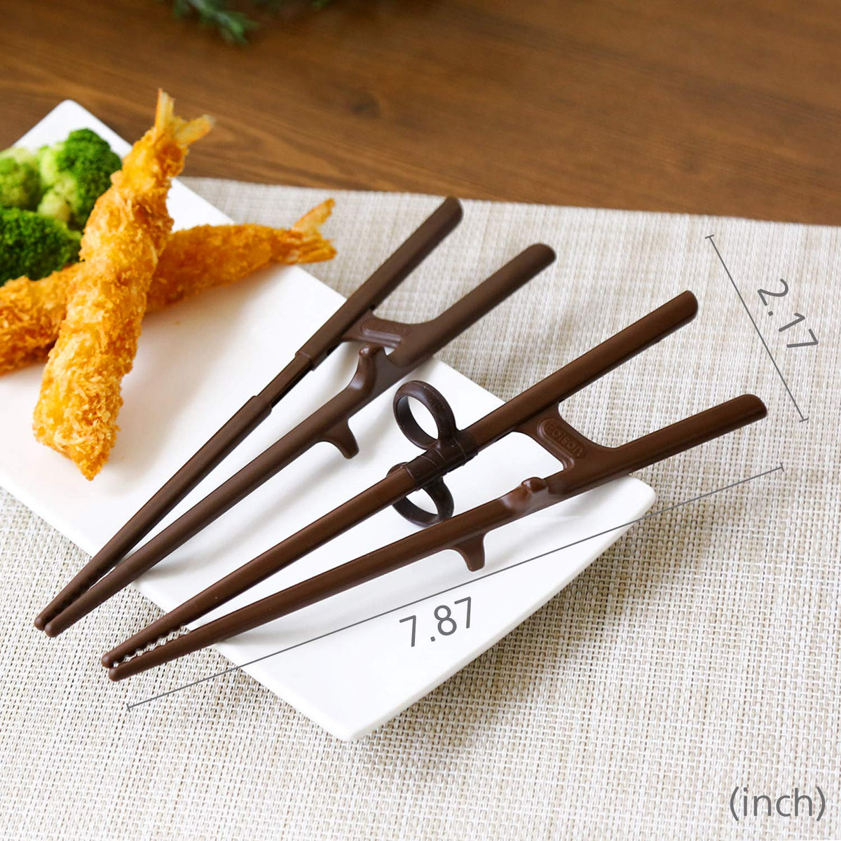 Edison Friends training chopsticks family-dining scene promotes fun learning together.