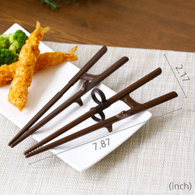 Edison Friends training chopsticks family-dining scene promotes fun learning together.