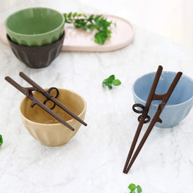Edison Friends chopsticks with sushi ramen scene highlights enjoyment while learning.