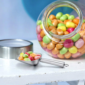 E-far mini scoop shown in glass jar for precise measuring in canisters.